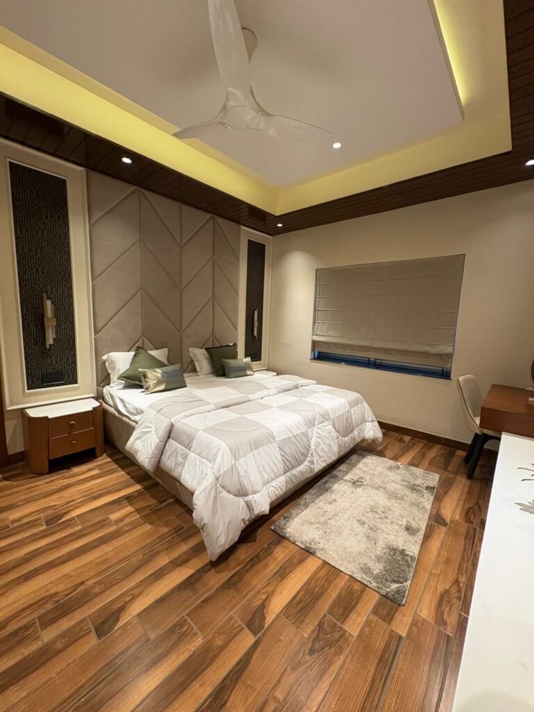 Luxury bedroom interior design with modern false ceiling and premium wooden flooring by LEVENUS